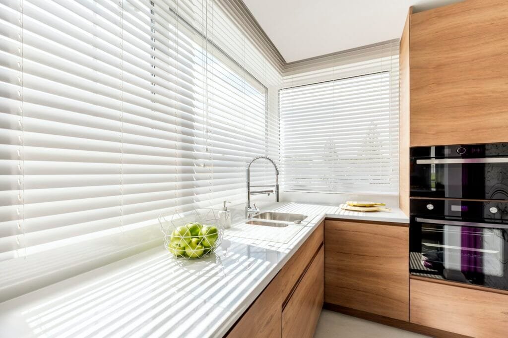 Kitchen with white window blinds